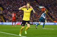 LIVERPOOL, ENGLAND - APRIL 14:  Marco Reus of Borussia Dortmund celebrates scoring his team's third goal during the UEFA Europa League quarter final, second leg match between Liverpool and Borussia Dortmund at Anfield on April 14, 2016 in Liverpool, United Kingdom.  (Photo by Shaun Botterill/Getty Images)